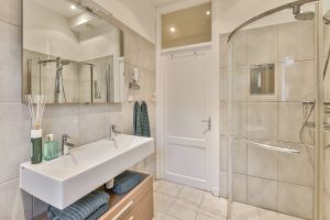 White bathroom | Featured image for AQWA Constructions Bathroom Remodel Ideas on a Budget blog.