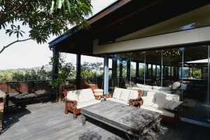 Luxury outdoor terrace overlooking garden area | Featured image for the AQWA Constructions Inspiration for Luxury Renovations blog.